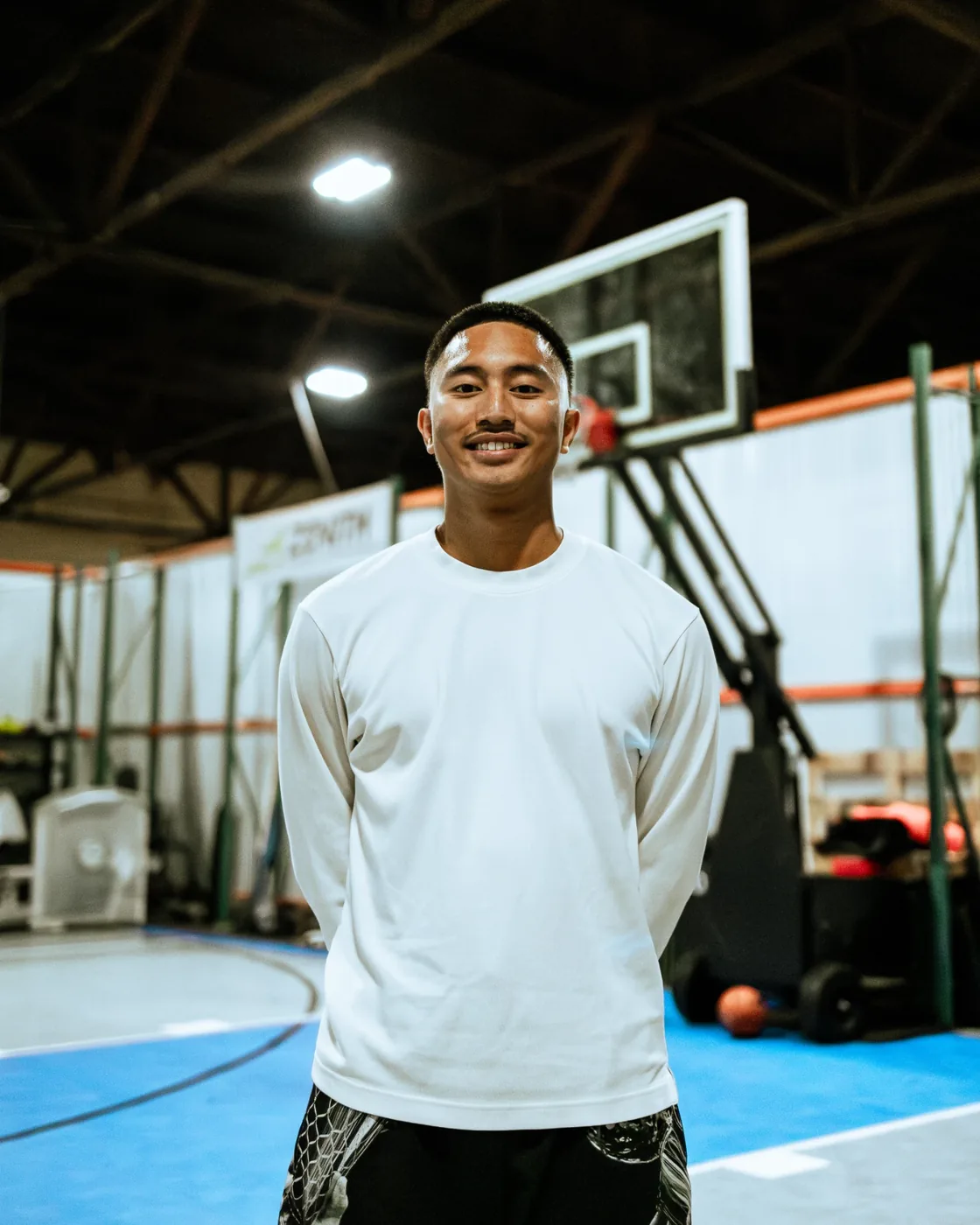 Coach Elijah De Guzman on the court at By Any Means San Jose